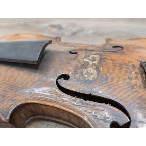 669 - An antique full-size violin labelled 'Antonius Stradiuarius'