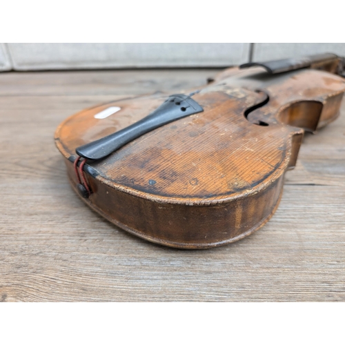 669 - An antique full-size violin labelled 'Antonius Stradiuarius'