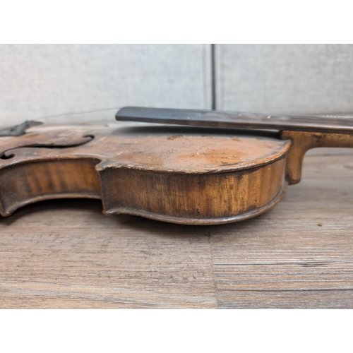 669 - An antique full-size violin labelled 'Antonius Stradiuarius'