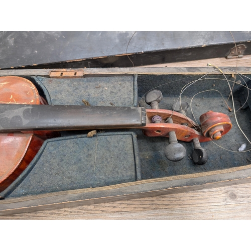 670 - A cased antique full size violin