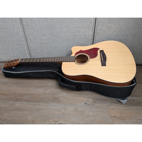 671 - A boxed and cased Donner DAG-1C cutaway dreadnought steel-strung acoustic guitar with strap, capo, b... 