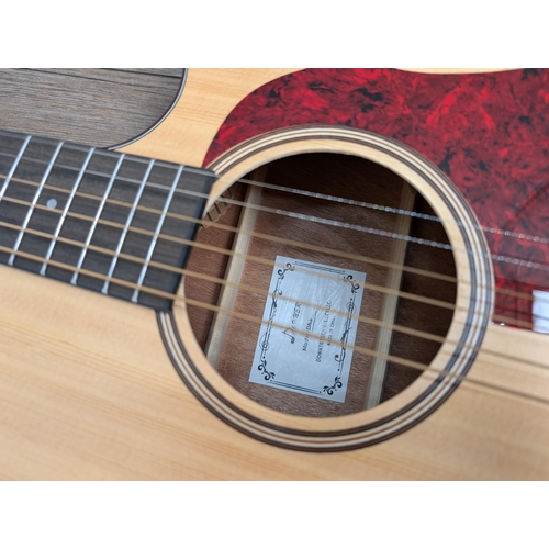 671 - A boxed and cased Donner DAG-1C cutaway dreadnought steel-strung acoustic guitar with strap, capo, b... 