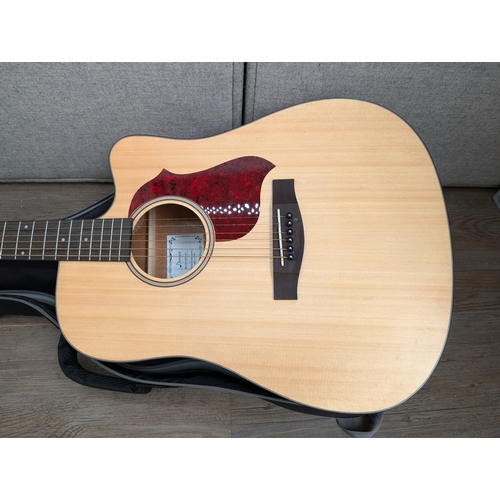 671 - A boxed and cased Donner DAG-1C cutaway dreadnought steel-strung acoustic guitar with strap, capo, b... 