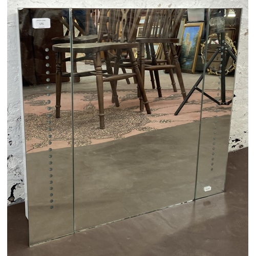 171 - A mirrored glass wall mountable LED bathroom cabinet - approx. 60cm high x 65cm wide x 12cm deep