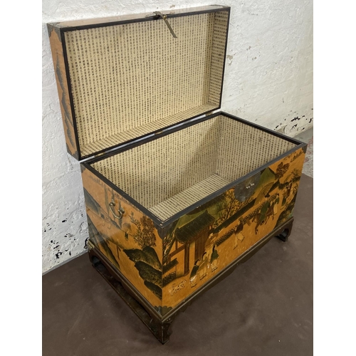 173 - A Chinese lacquered and brass blanket box on hardwood stand - approx. 62cm high x 80cm wide x 48cm d... 