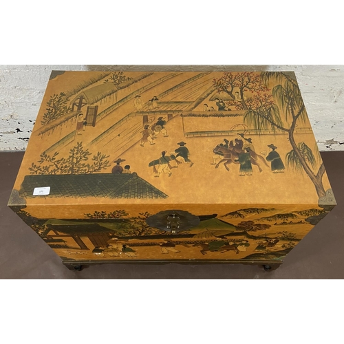 173 - A Chinese lacquered and brass blanket box on hardwood stand - approx. 62cm high x 80cm wide x 48cm d... 