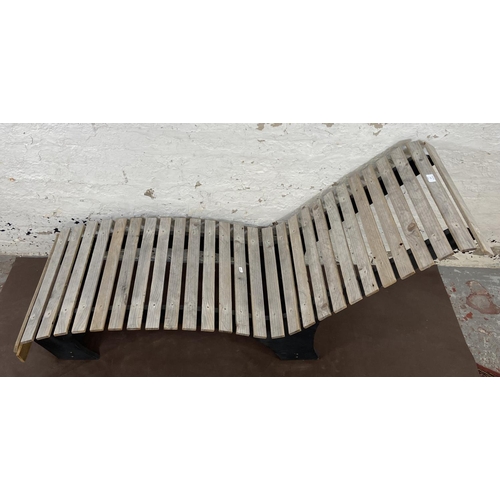 177 - A wooden slatted and black painted garden sun lounger - approx. 73cm high x 54cm wide x 156cm long