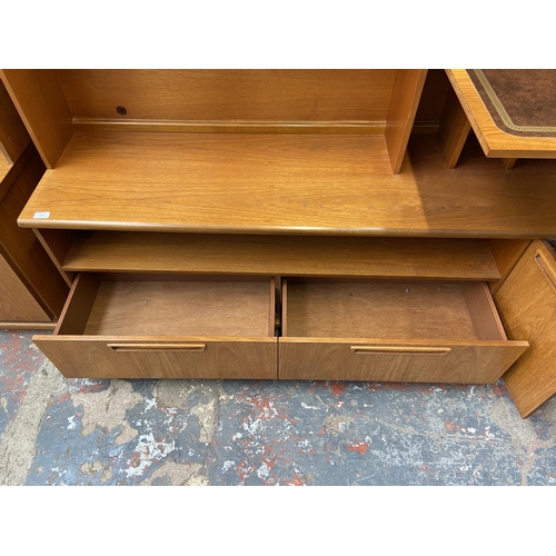 235 - A mid 20th century Meredew teak display unit - approx. 165cm high x 200cm wide x 45cm deep