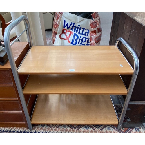 246 - A modern beech and tubular metal three tier shelving unit