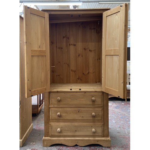 131 - A modern pine double wardrobe - approx. 183cm high x 91cm wide x 55cm deep