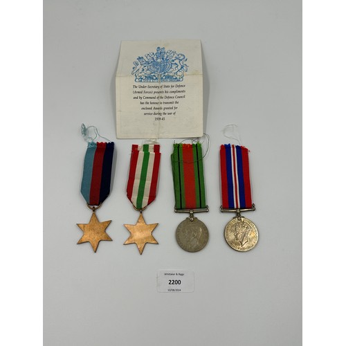 2200 - Four WWII British medals, The Italy Star, The 1939-1945 Star, The Defence and War