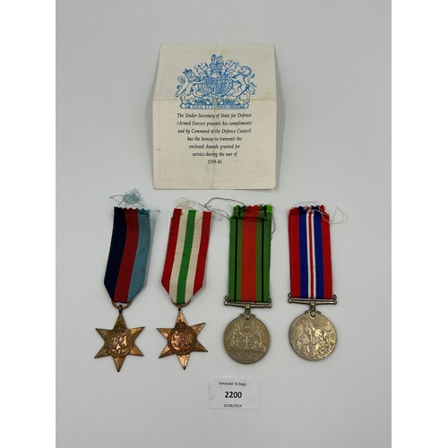 2200 - Four WWII British medals, The Italy Star, The 1939-1945 Star, The Defence and War