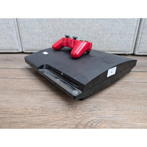 701 - Three items, one Sony PlayStation 3 CECH-2003A games console with Dualshock controller, one boxed To... 