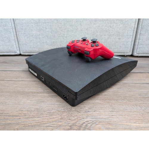 701 - Three items, one Sony PlayStation 3 CECH-2003A games console with Dualshock controller, one boxed To... 