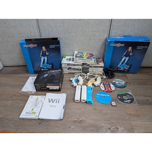 703 - A collection of gaming related items, Microsoft Xbox Elite Series 2 controller empty box, Nintendo W... 