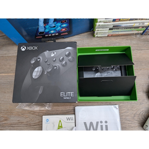 703 - A collection of gaming related items, Microsoft Xbox Elite Series 2 controller empty box, Nintendo W... 