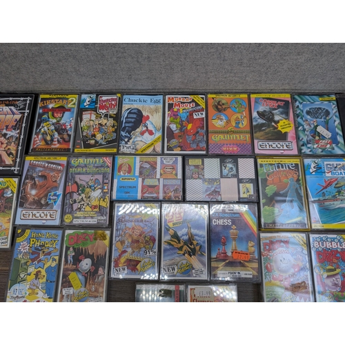 707 - A collection of Sinclair Spectrum 48K/128K game cassettes to include Crazy Cars, Everyone's A Wally,... 