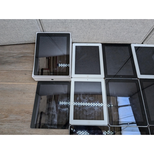 710 - A collection of 32-pin Apple iPads to include A1395, A1416, A1219, A1337 etc.