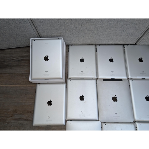 710 - A collection of 32-pin Apple iPads to include A1395, A1416, A1219, A1337 etc.