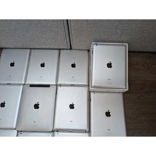 710 - A collection of 32-pin Apple iPads to include A1395, A1416, A1219, A1337 etc.