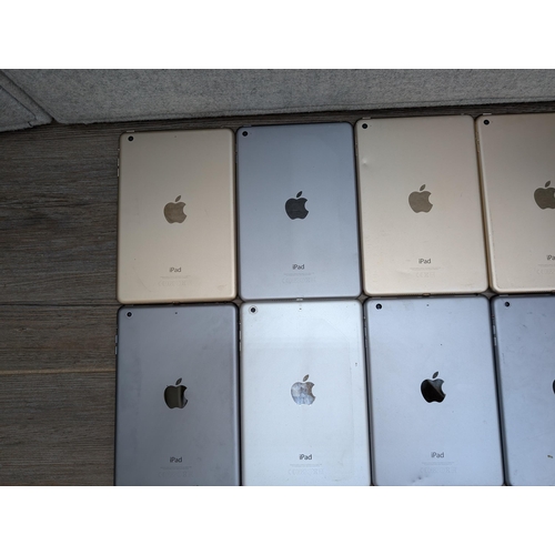 716 - A collection of Apple iPad Mini tablets to include A1538, A1489, A1432, A1599 etc.