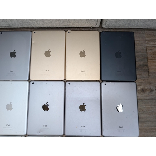 716 - A collection of Apple iPad Mini tablets to include A1538, A1489, A1432, A1599 etc.