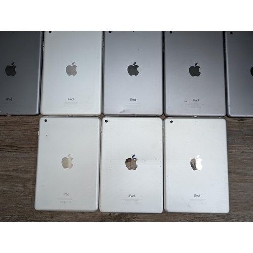 716 - A collection of Apple iPad Mini tablets to include A1538, A1489, A1432, A1599 etc.