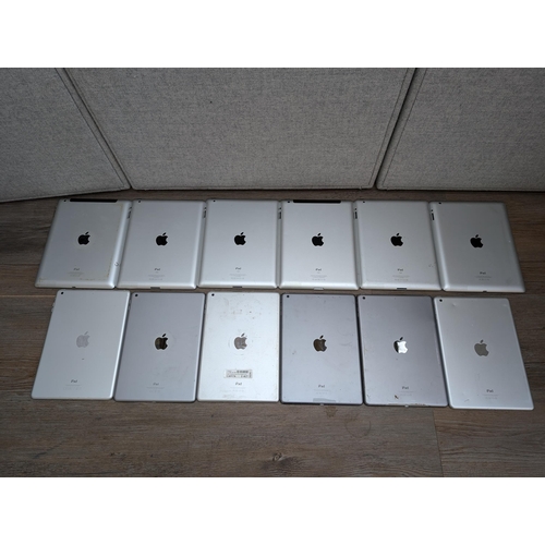 722 - A collection of Apple iPads to include A1395, A1474, A1893 etc.