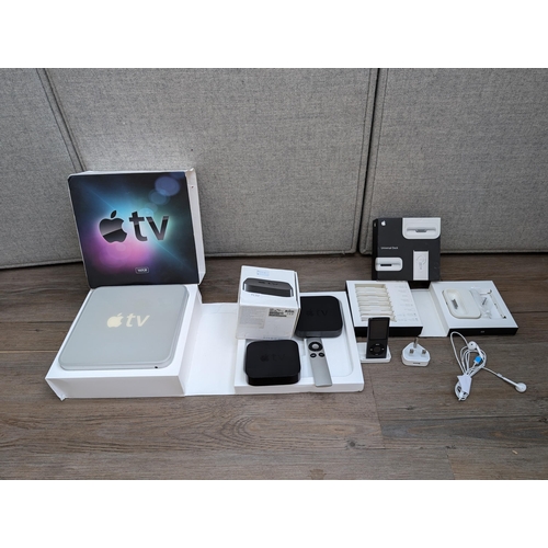 727 - A collection of Apple items to include three Apple TV streaming devices, iPod Nano 4th generation, b... 