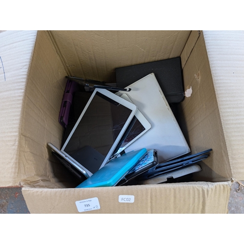 735 - Two boxes containing tablet cases and tablets for spares or repair