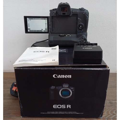 589 - A boxed Canon EOS R mirrorless 30.3mp full-frame digital camera body fitted with Canon BG-E22 batter...