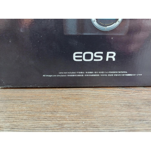 589 - A boxed Canon EOS R mirrorless 30.3mp full-frame digital camera body fitted with Canon BG-E22 batter... 