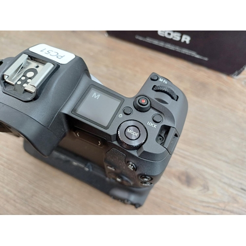 589 - A boxed Canon EOS R mirrorless 30.3mp full-frame digital camera body fitted with Canon BG-E22 batter... 