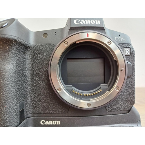 589 - A boxed Canon EOS R mirrorless 30.3mp full-frame digital camera body fitted with Canon BG-E22 batter... 