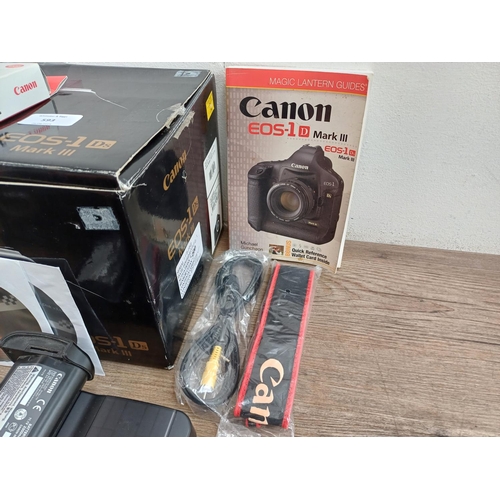 593 - A boxed Canon EOS-1Ds Mark III 21mp professional full-frame DSLR camera body with power adapter, str... 