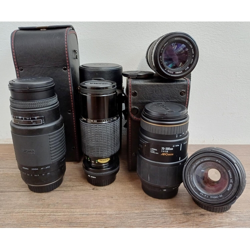 596 - Five Sigma camera lenses to include cased 70-300mm 1:4-5.6 APO macro, Sigma 75-300mm 1:4.5-5.6AF-APO... 