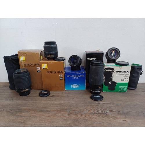 597 - Five boxed camera lenses, one Vivitar MC 1:5.6-6.7 100-300mm macro focusing zoom, one Nikon Nikkor A... 