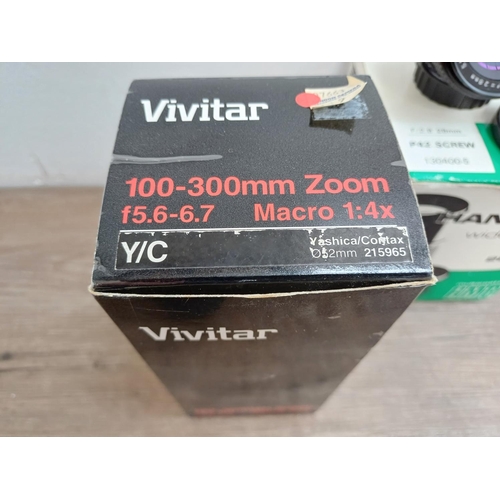 597 - Five boxed camera lenses, one Vivitar MC 1:5.6-6.7 100-300mm macro focusing zoom, one Nikon Nikkor A... 