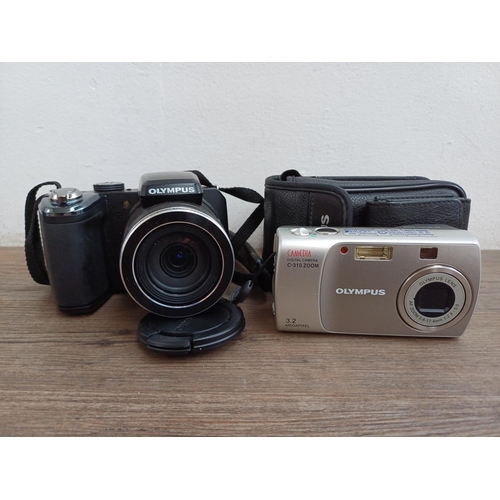 600 - Two Olympus digital cameras, one Stylus SP-820UZ 14mp and one cased Camedia C-310 3.2mp