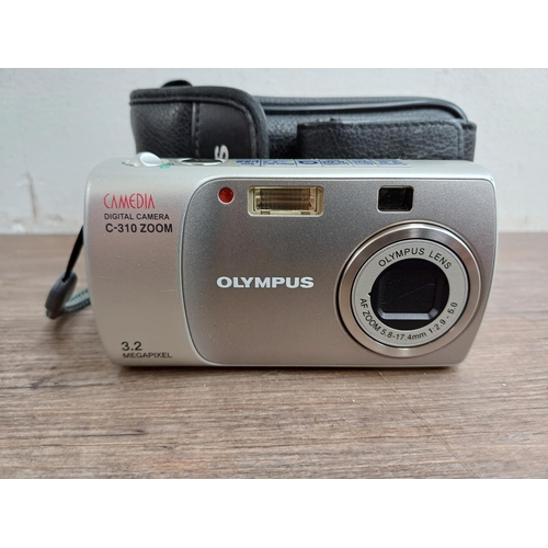 600 - Two Olympus digital cameras, one Stylus SP-820UZ 14mp and one cased Camedia C-310 3.2mp