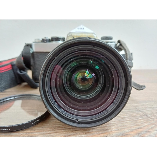 603 - A Nikon FE 35mm SLR camera fitted with Nikkor 28-85mm 1:3.5-4.5 lens