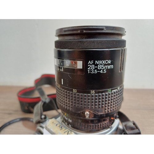 603 - A Nikon FE 35mm SLR camera fitted with Nikkor 28-85mm 1:3.5-4.5 lens