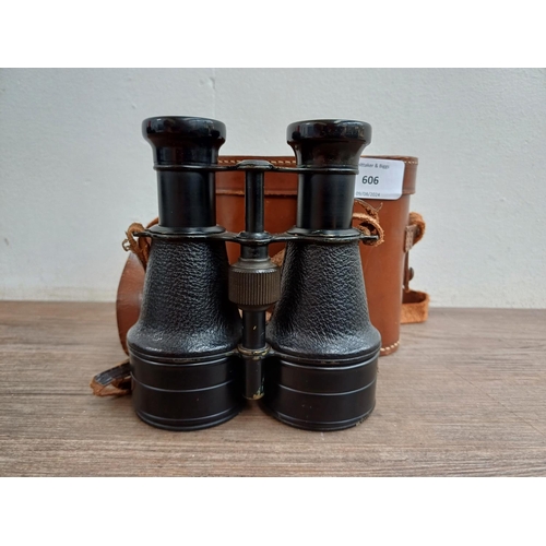 606 - A cased pair of vintage binoculars marked B S C.A.3 62mm