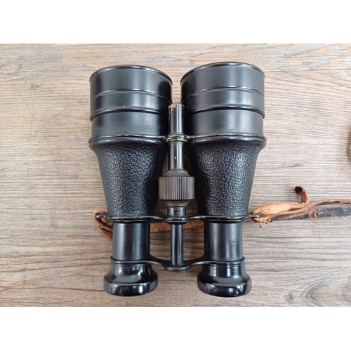 606 - A cased pair of vintage binoculars marked B S C.A.3 62mm