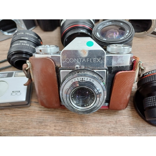 609 - A collection of lenses and cameras to include Minolta 7000 Maxxum 35mm SLR, Ihagee Exa II body, Niko... 