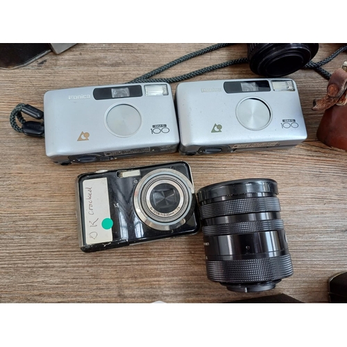 609 - A collection of lenses and cameras to include Minolta 7000 Maxxum 35mm SLR, Ihagee Exa II body, Niko... 