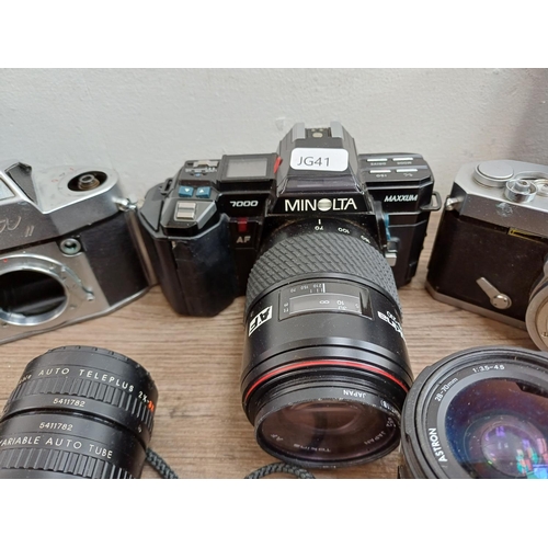 609 - A collection of lenses and cameras to include Minolta 7000 Maxxum 35mm SLR, Ihagee Exa II body, Niko... 