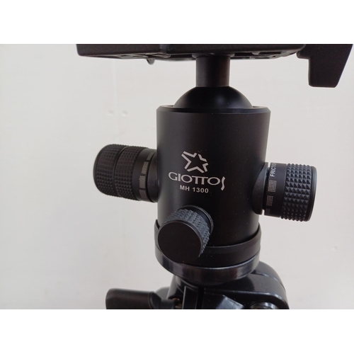 611 - A cased Giottos MTL 8361B professional carbon fiber tripod fitted with MH 1300-652 ball-head with fr... 