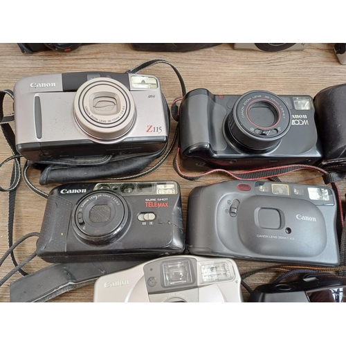 613 - A collection of Canon compact cameras to include AF35ML, Sure Shot AF-7, Sure Shot Zoom, IXUS 970 IS... 