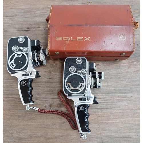 616 - Two Paillard Bolex D-8L rotatable turret, three lens 8mm cine cameras, one cased